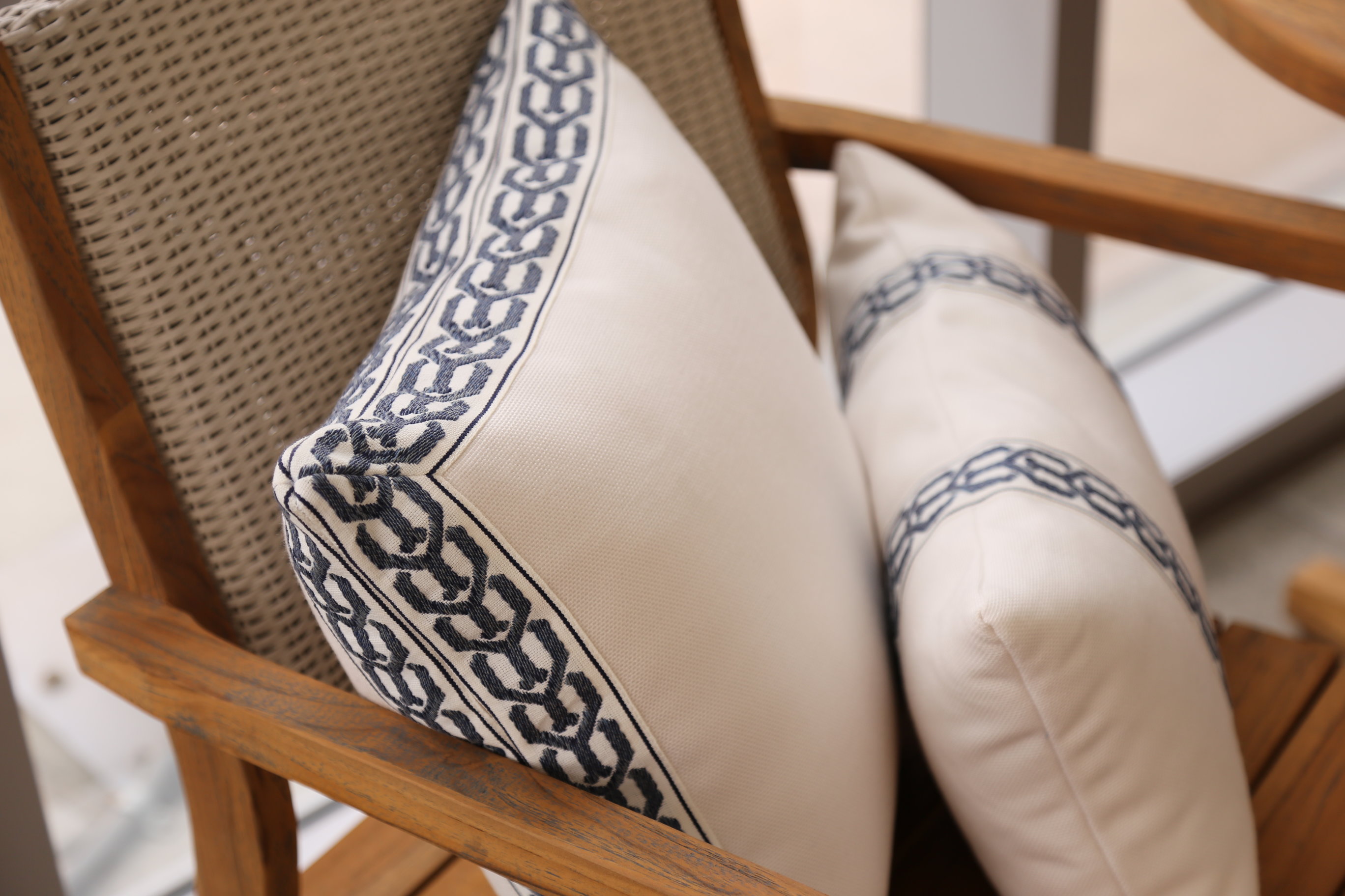 Custom decorative tape on outdoor seat pillows